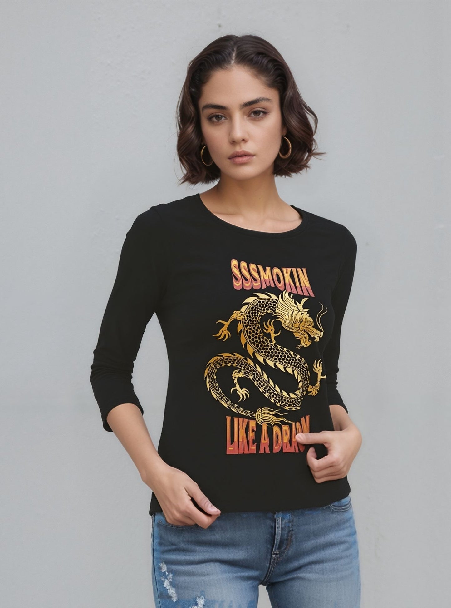 Woman wearing a black long-sleeve shirt with a dragon graphic and text on a gray background