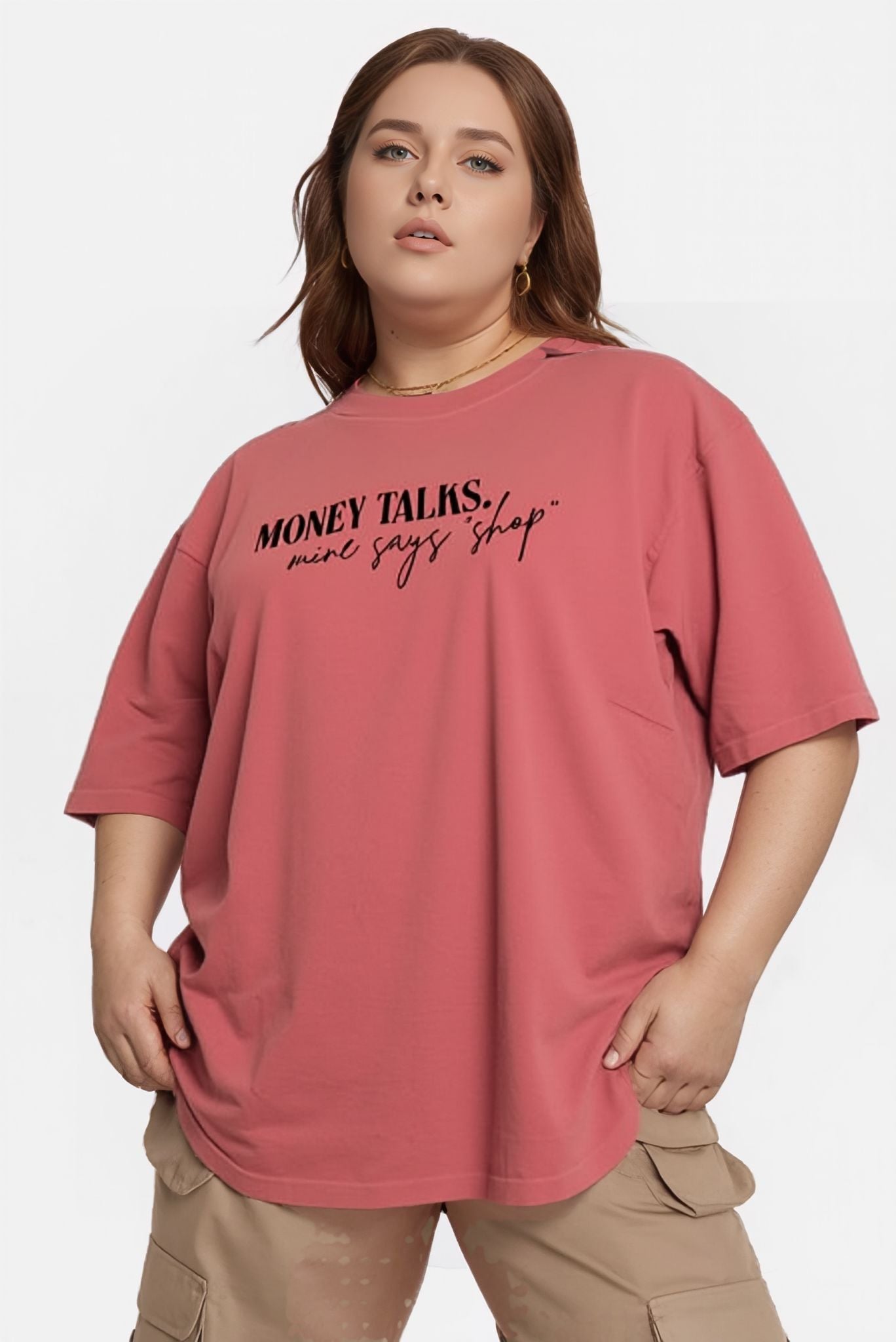 Person wearing a CORAL t-shirt with text on a white background