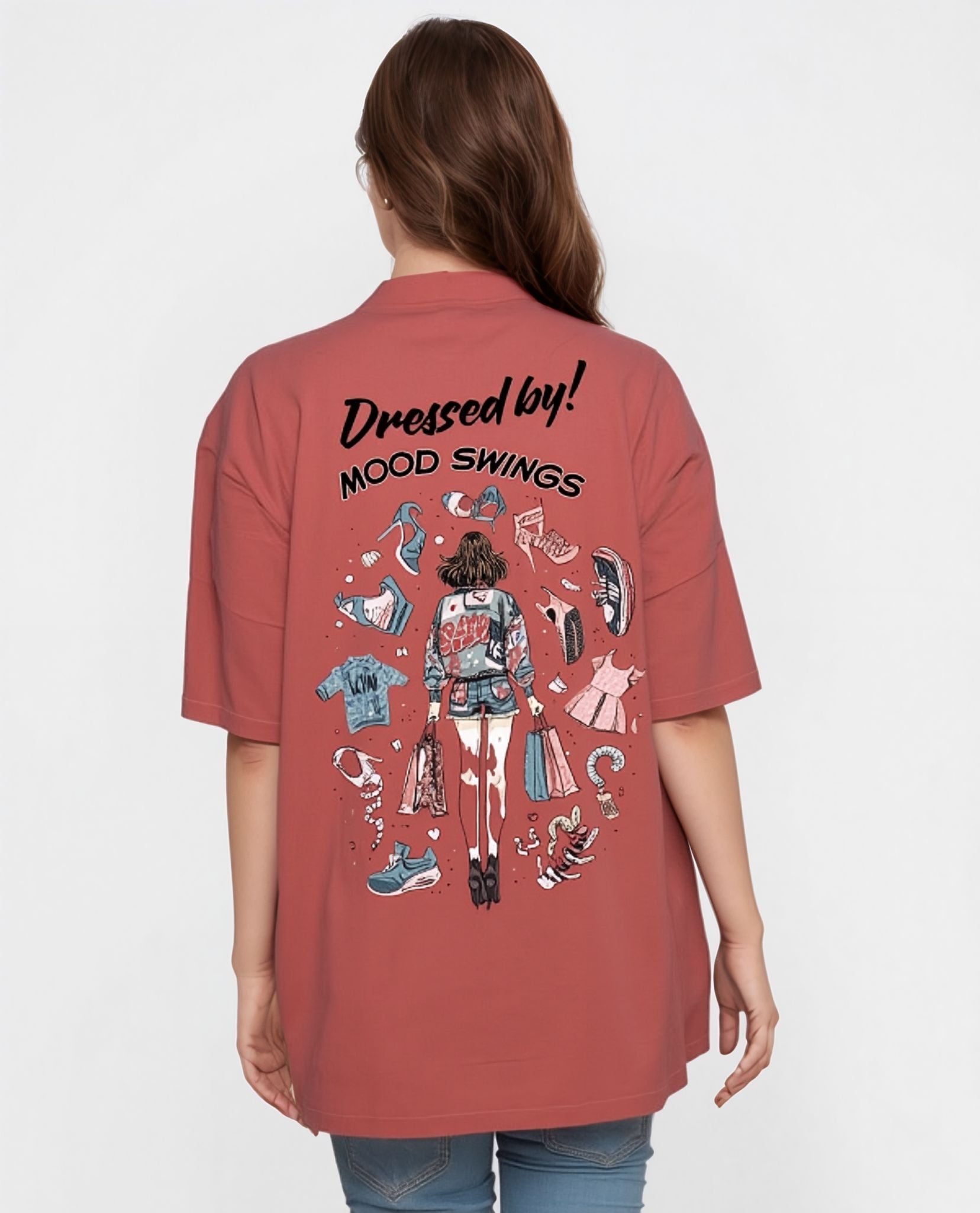 Person wearing a coral shirt with a graphic design and text on the back against a white background