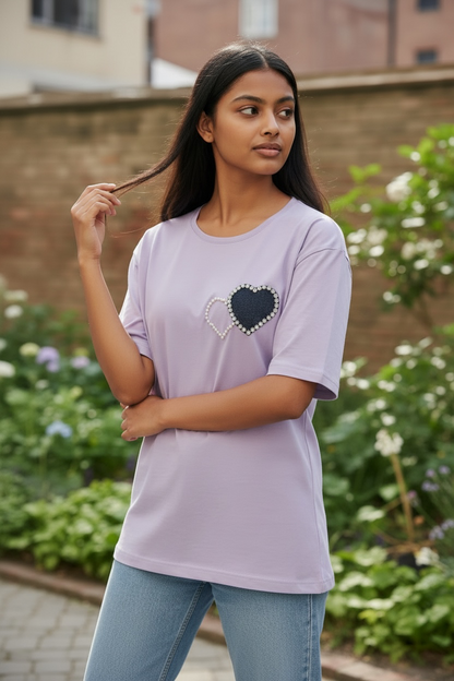 Model wearing women’s lavender pearl heart patch cotton T-shirt with blue jeans
