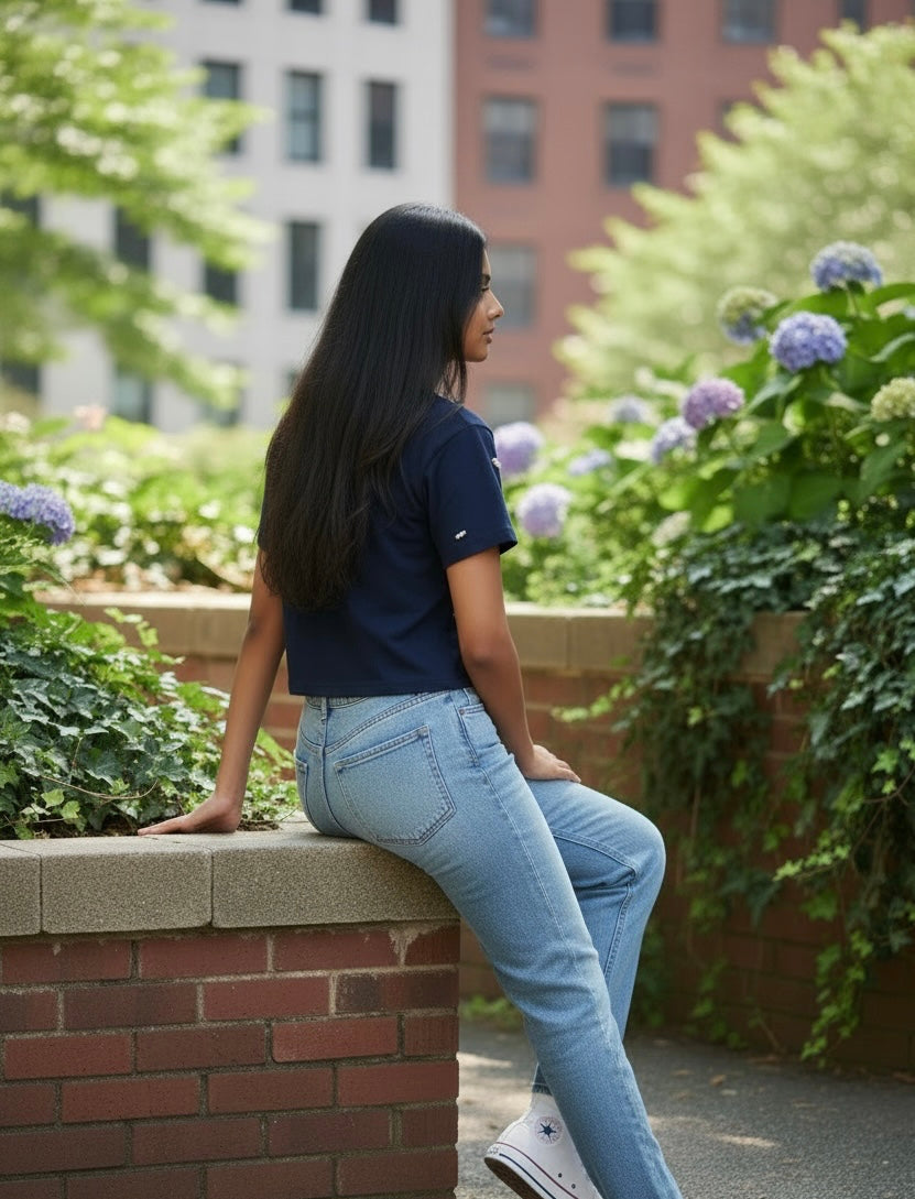 Back view of women’s navy pearl embellished cotton crop T-shirt